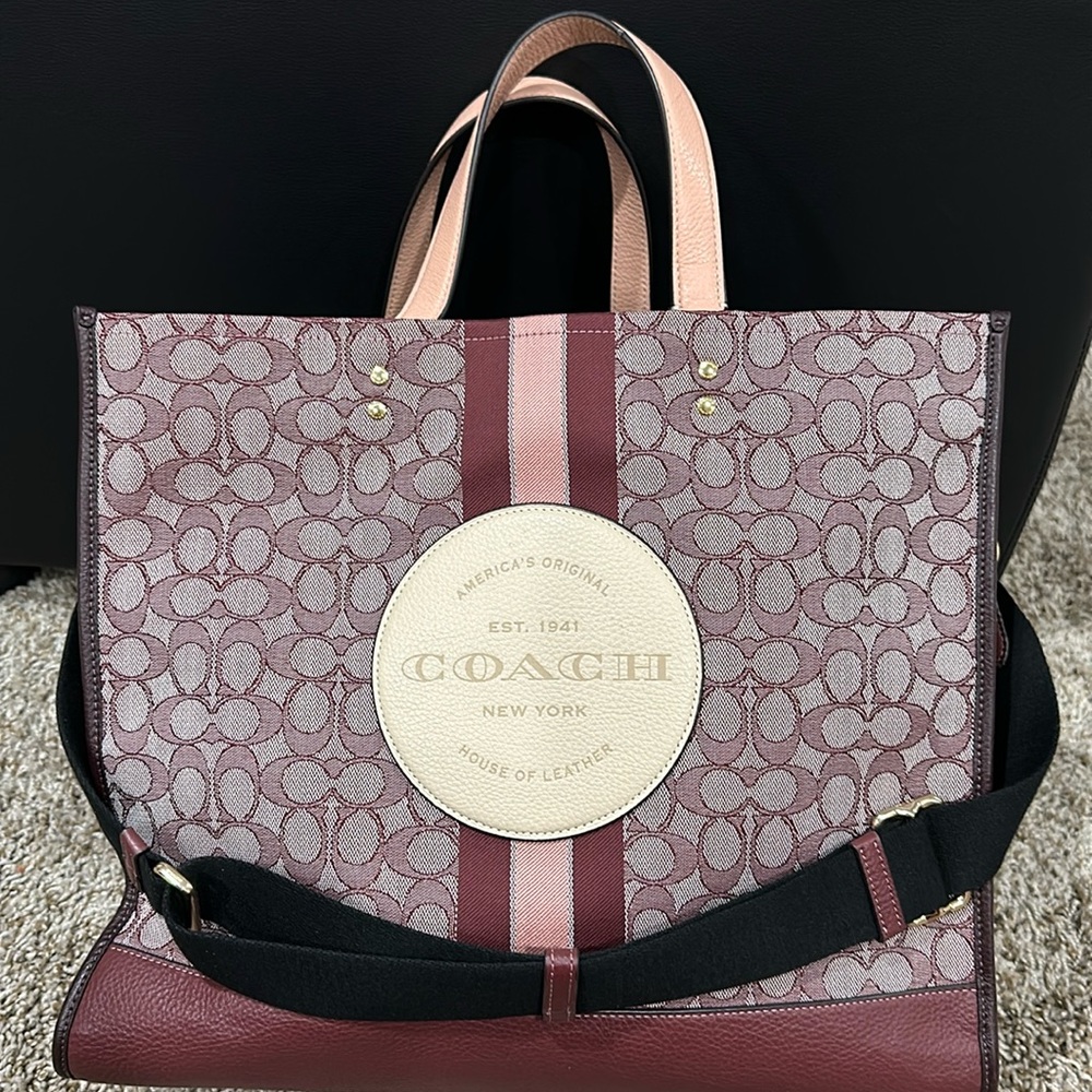 This is a Dempsey tote bag from coach